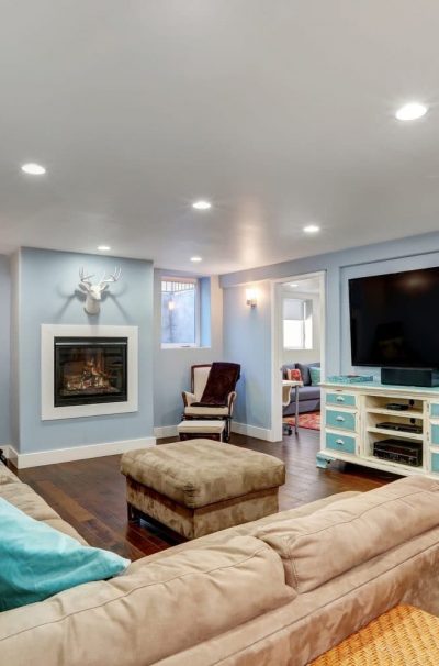Pastel Blue Walls In Basement Living Room Interior.